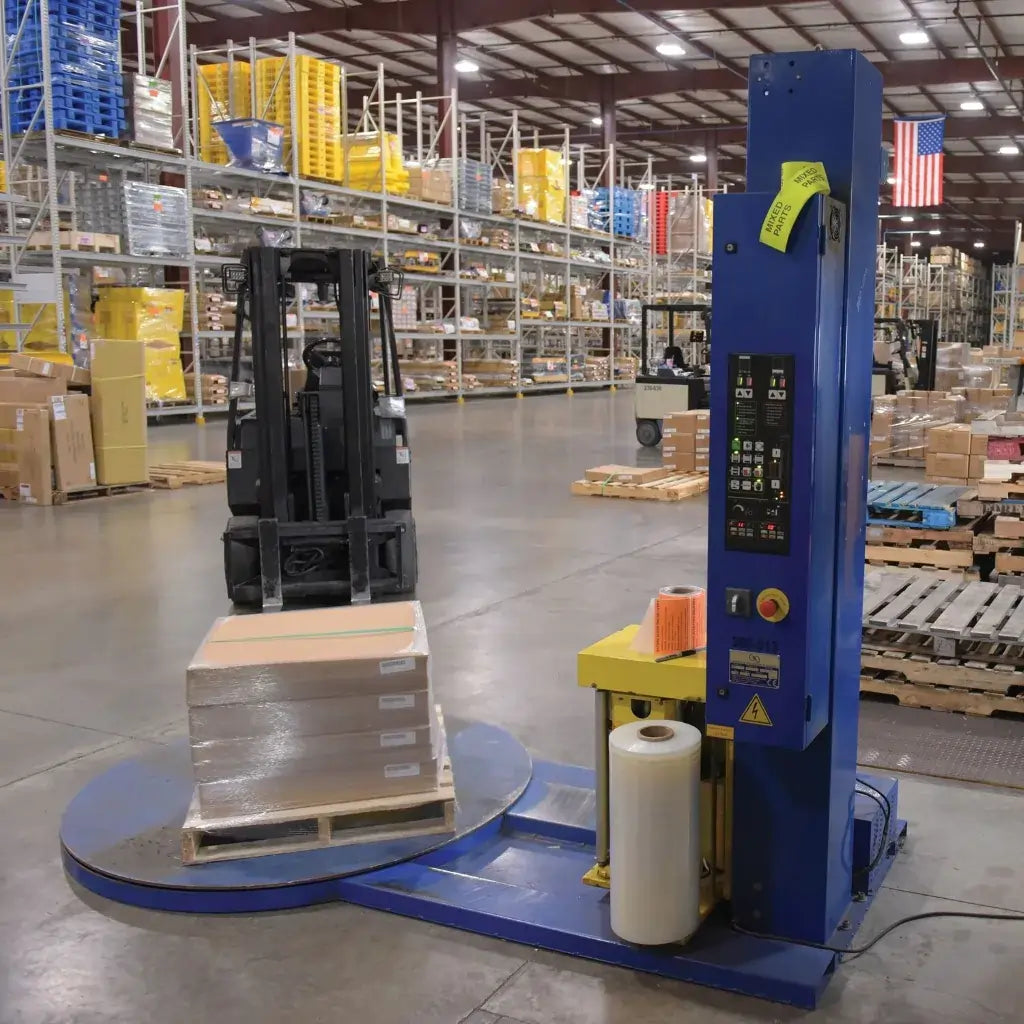 blue and yellow stretch wrap machine in warehouse